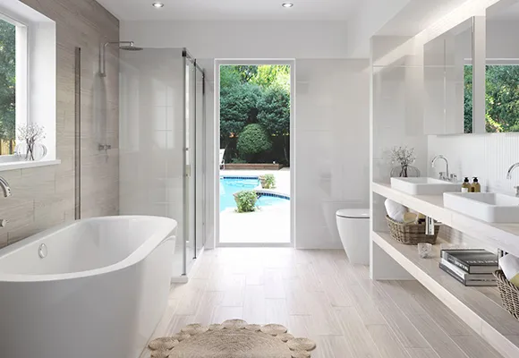 Complete bathroom overhaul featuring upgraded fixtures, modern tiles, custom cabinetry, and a luxurious freestanding bathtub.